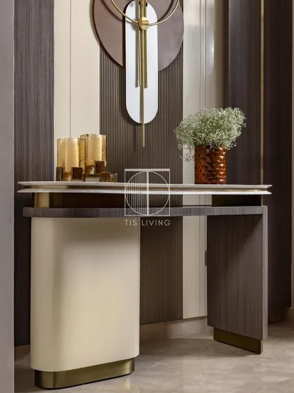 This console makes a statement the moment you step in. We designed it with a dual-layered stone top embedded in a handcrafted brass frame, creating a bold and sculptural first impression.