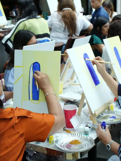 The focus and fun of a paint party. Guests were completely absorbed in creating their own versions of a beautiful Santorini-inspired door, making for a truly unique birthday experience.