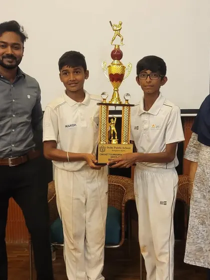 The team captains receiving the U13 inter-school tournament trophy from the chief guest, a proud moment for the entire academy.