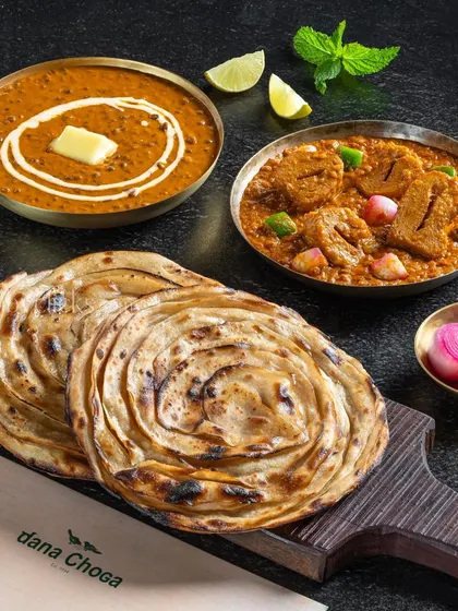A bread-focused combo with Dal Makhani, Soya Chaap Masala, and flaky Lachha Parathas.