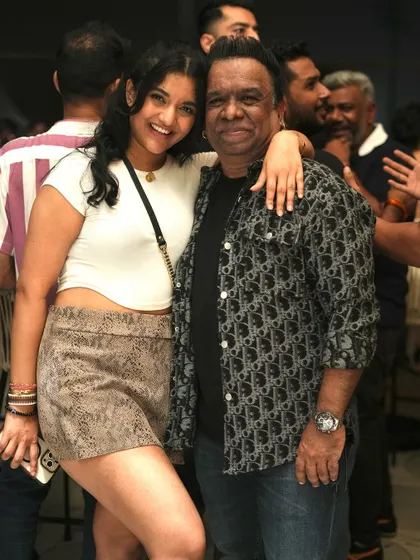 Posing with a fan at our rooftop sundowner. I love connecting with the people who come to my shows.