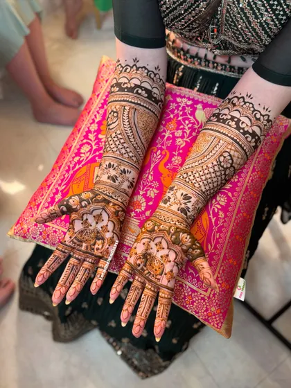 Another view of Laura's stunning bridal mehendi, showcasing the intricate details and balanced composition of the design.
