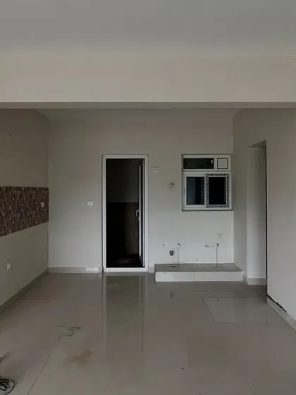 Before: The original galley kitchen layout in 'The Flux Abode', which felt closed off and dated.