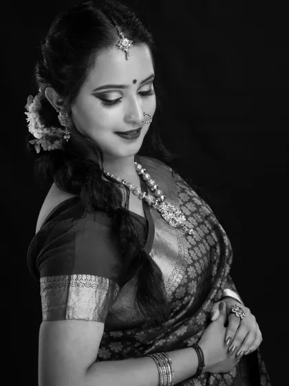 Another elegant black and white shot. It emphasizes the soft glam of the eye makeup and the traditional hairstyle, proving that a great bridal look is stunning in any format.