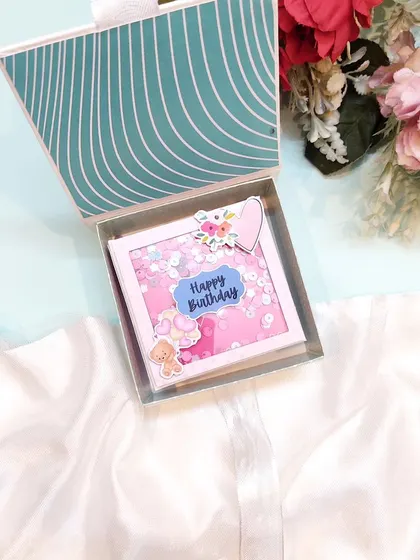 The mini scrapbook comes with a matching box for safekeeping and beautiful presentation.