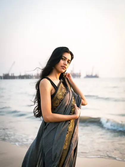 This shot includes the distant view of the sea link, grounding the ethereal beach scene firmly in Mumbai.
