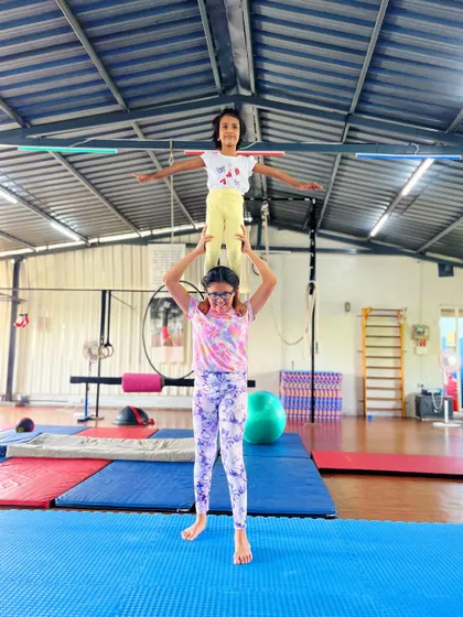 This team shows great focus and communication, holding a steady two-high pose. Partner acrobatics is all about working together.