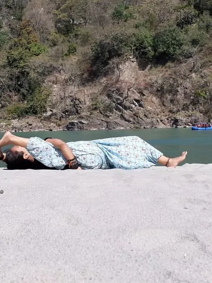 "Through practice comes Yoga, through Yoga comes knowledge." A moment of rest and a gentle stretch on the banks of the Ganga.