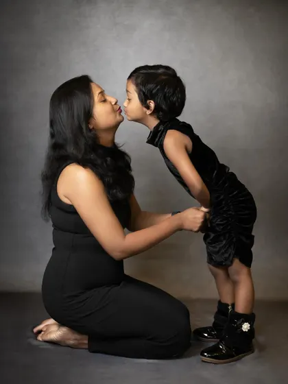 A duplicate of image 3, showing a tender moment between a mother and her daughter. This classic pose beautifully captures the mother-child bond.