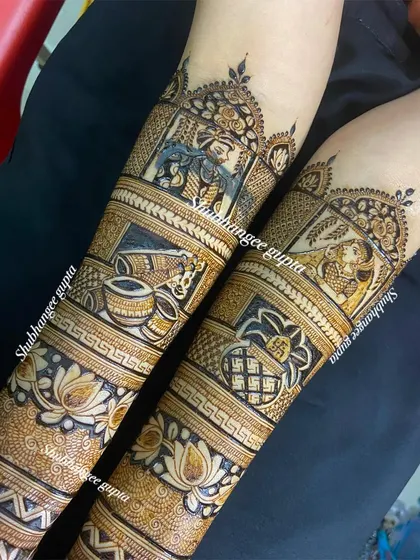 A full view of a bridal design with portraits of Radha and Krishna. This is a beautiful option for couples who want to incorporate spiritual elements into their wedding mehndi.