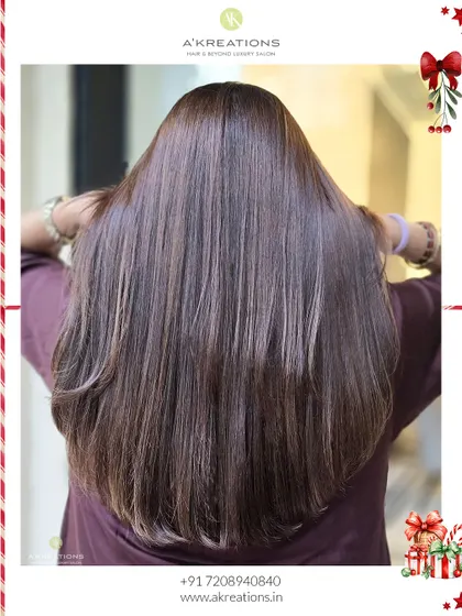 The back view of this buttery brown color, showing off the sleekness and subtle highlights after a cut and color service.