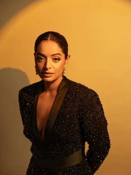 A warm, glowing shot that highlights the incredible shimmer of the Rohit Gandhi Rahul Khanna dress. Pure red carpet magic.