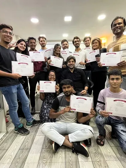 A group photo celebrating the successful completion of a course. These students are not just a batch; they are a community of future stylists.