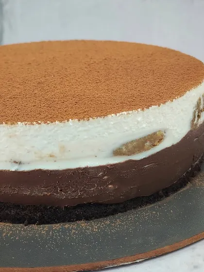 A close-up of the smooth, creamy layers of my Tiramisu Cheesecake. It's an eggless take on the classic Italian dessert, and it's one of my personal favorites.