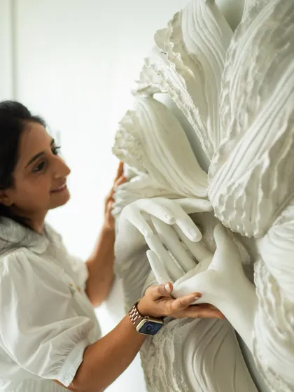 A close-up moment with 'The Awakening Cycle series 2'. The details are where the story lives, in the gentle touch of the hands and the flow of the surrounding textures.