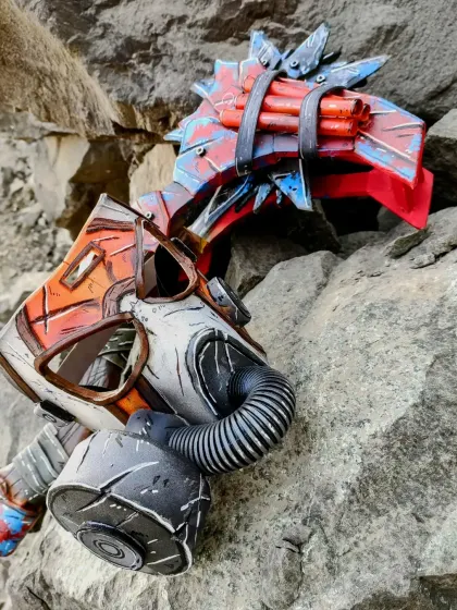 The finished and fully painted Krieg mask and Buzz-axe, looking like they were pulled straight out of the game. The weathering and battle-damage effects were fun to create.
