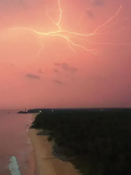 A dramatic drone shot capturing a fork of lightning illuminating the sky over Kapu lighthouse and the coastline. This image showcases my technical skill in aerial cinematography and my passion for capturing nature's most powerful moments.