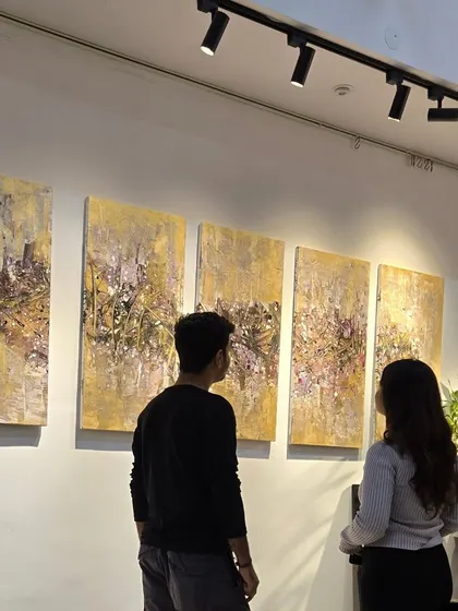 Visitors at the "Unknown Realms" exhibition, which features abstract contemporary artists from Bangalore. We are a leading gallery for modern art in the city.