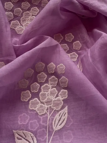 A vibrant purple Mul Chanderi with delicate white appliqué work. The contrast of colors makes this a striking choice for a stylish kurta or dress.
