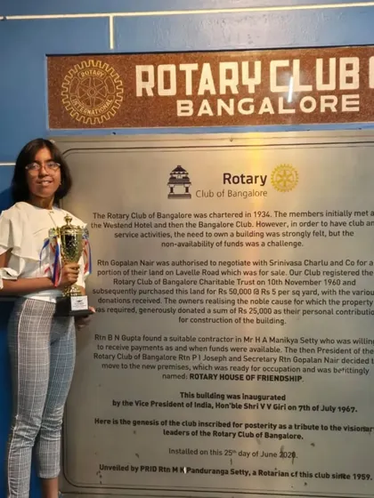 Prachita Deb holding her Individual Championship trophy at the Rotary Club of Bangalore, a proud moment for the entire Swimsquare family.