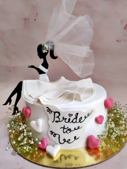 Another take on a bride-to-be cake, this time with a delicate net veil and baby's breath. The ruffle skirt detail is one of my favorite things to create.