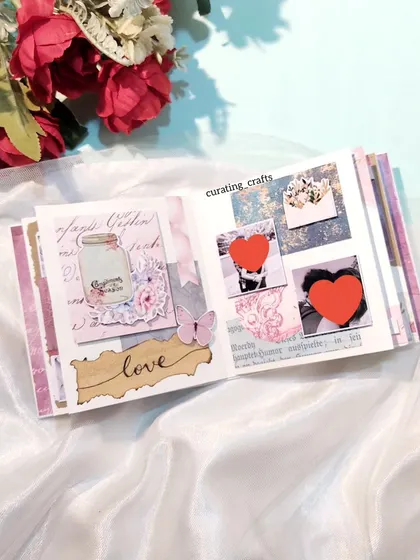 Another page from the vintage album with heart-covered photos.