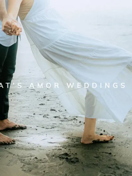 A close-up detail shot of a couple's feet in the sand, with the bride's white dress flowing. It’s a simple, romantic image that speaks volumes.