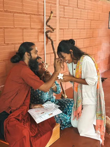 A graduate receives her certificate, her face beaming with joy. This moment marks not an end, but the beginning of a new chapter as a confident and knowledgeable yoga teacher.