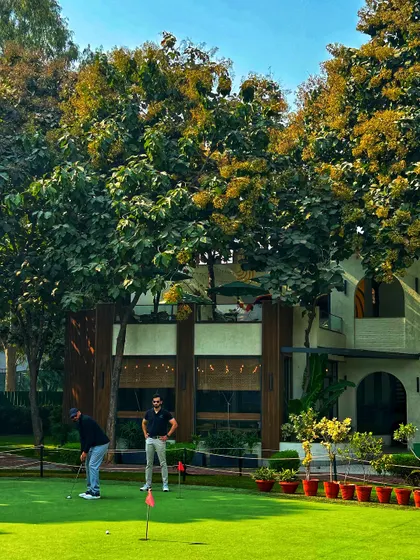 The range is for everyone. Golfers practice on the putting green in front of our beautiful clubhouse.