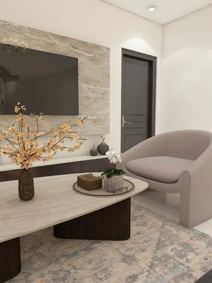 A comfortable accent chair provides extra seating and adds a soft, sculptural element to the living room corner.