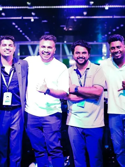 Posing with the event management team and fellow artists after a successful corporate show. Strong collaboration ensures a smooth and stress-free event for the client.
