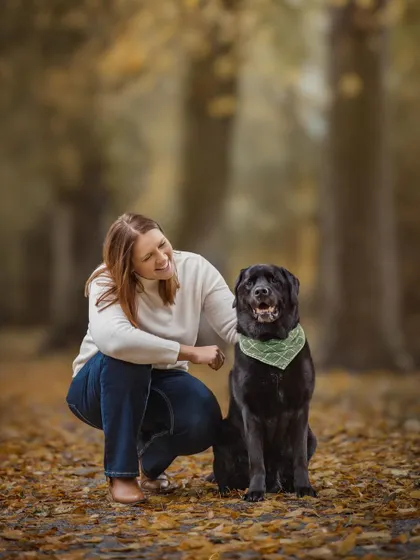 A sweet, candid moment between a woman and her black lab in a beautiful, leafy autumn setting. It’s the simple, loving interactions that make the most powerful photographs.