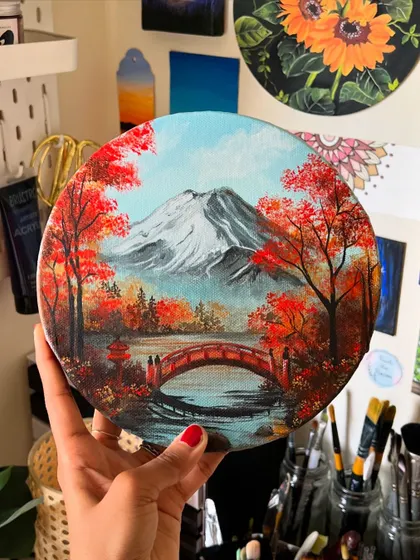 Holding the finished round Mt. Fuji painting.