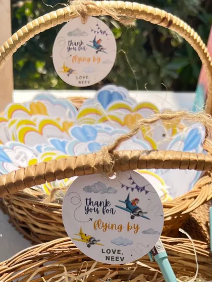More custom tags for a first birthday, including cloud-shaped wish cards and airplane-themed thank you tags.