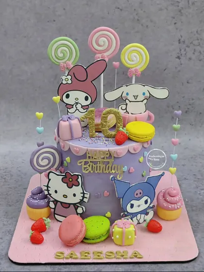 Another take on our popular Sanrio Candyland cake, this time in purple. It's adorned with lollipops, macarons, and cupcakes, featuring Hello Kitty and her friends.
