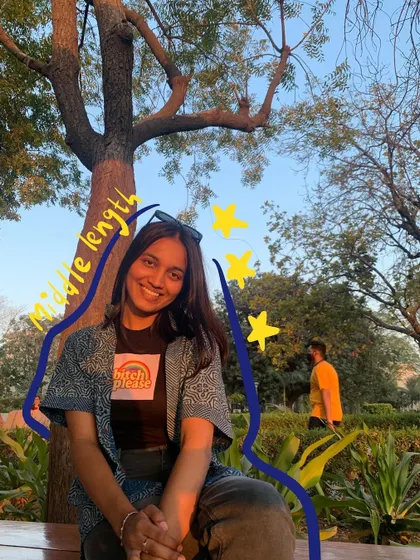 My middle-length hair era, with some simple blue doodles and stars.