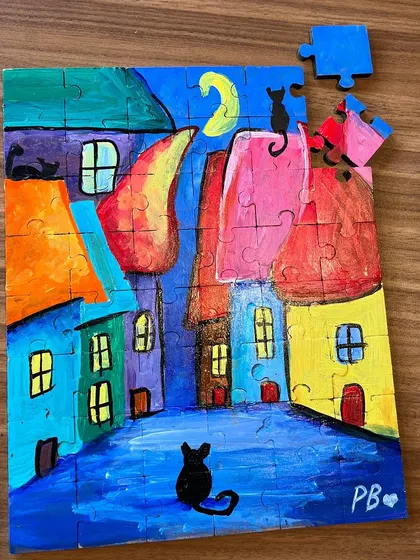 Another beautiful puzzle painting, this one featuring a cat in a colorful city at night. The possibilities are endless.