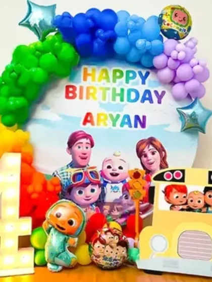 For the little ones, I bring their favorite characters to life. This Cocomelon themed birthday setup features a custom backdrop, a vibrant rainbow balloon arch, character cutouts, and a large light-up marquee number to make the birthday boy or girl feel extra special.