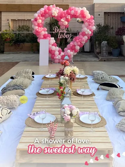 A shower of love for the bride-to-be! We created this Beyoncé-inspired bridal shower with a heart-shaped balloon backdrop and a dreamy boho sit-down picnic setup on a sunny terrace. It was the perfect setting for a flawless "final fling before the ring."