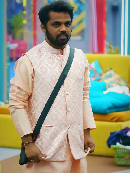 A different angle of the peach kurta set, showing the fine texture of the brocade jacket. This is a great example of a semi-formal ethnic outfit for men.