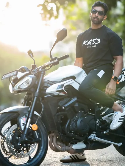 Posing with my bike, wearing apparel from a local brand. I support local businesses that align with my lifestyle.