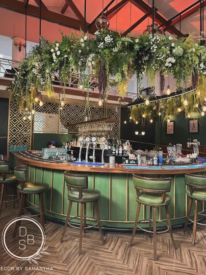 We gave the bar a fresh new look for the Karnataka Golf Association's 50th-anniversary celebration, with a massive hanging floral installation that added drama and sophistication.