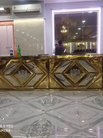 My high-end golden buffet counters set up in a banquet hall, ready for a wedding reception. These counters are available for rent.