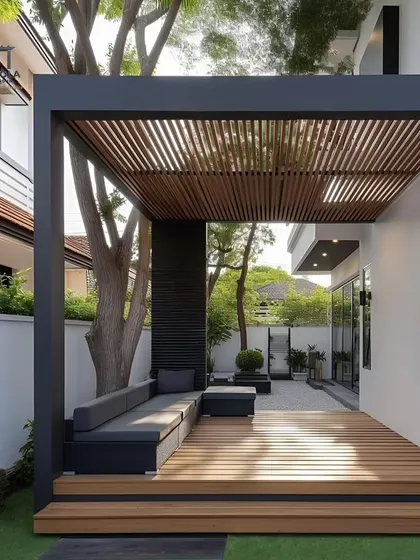 A cantilevered rafter pergola creates a stylish and functional covering for this wooden deck. The design requires fewer support posts, resulting in a clean, open feel that seamlessly connects the indoor and outdoor areas.