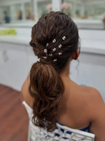 Another shot of the modern textured ponytail, a great choice for a sangeet or cocktail party.