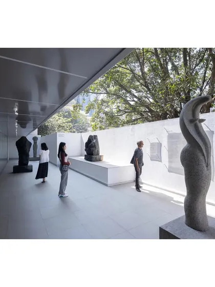 The sculpture court at MAP, a transitional space between the interior galleries and the city. We designed this area to be a quiet, contemplative zone, using natural light and a simple material palette to highlight the art and create a serene public experience.