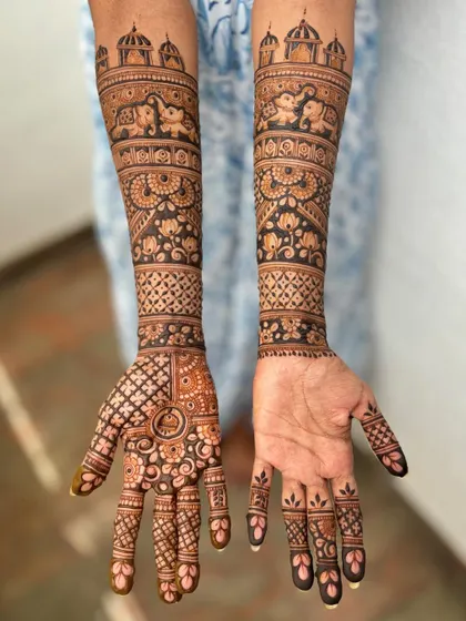 A straight-on view of the adapted bridal design, showing the full artwork on the arms and one hand.