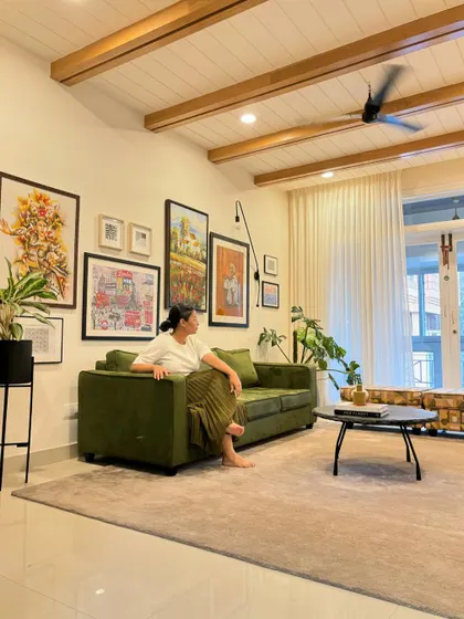 A candid shot of me enjoying the finished living room. It’s always rewarding to see a vision come to life and feel the comfort and character of the space we've created.