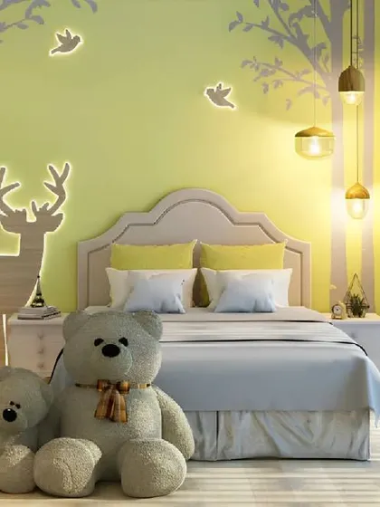 A gentle, nature-inspired bedroom with a backlit deer silhouette on the wall. The soft yellow tones and large teddy bears create a warm and cuddly environment.