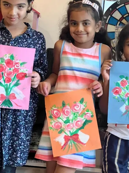 Three lovely artists with their three lovely bouquets. Each one chose their own background color, making their painting unique.